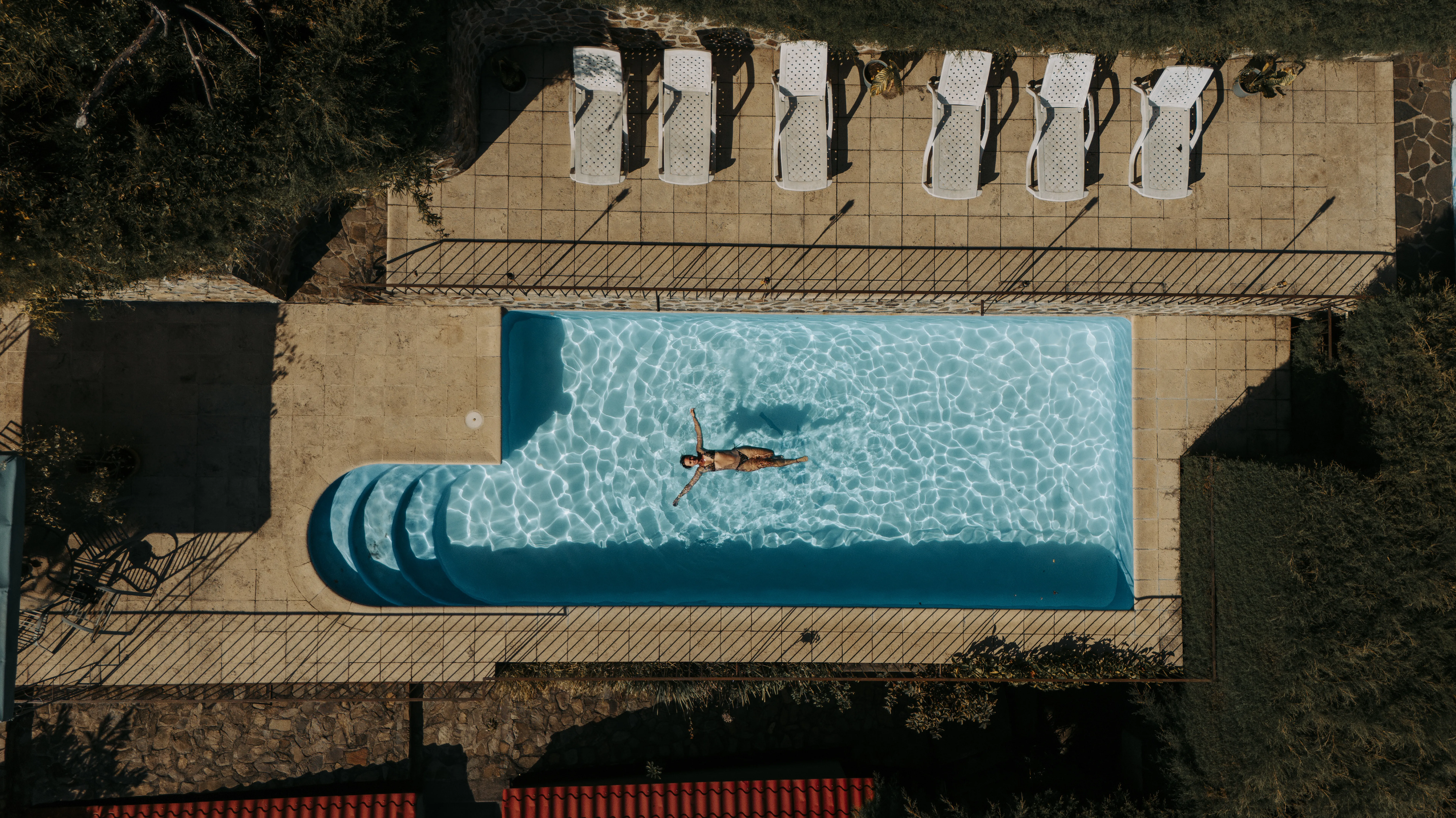 Infinity pool with panoramic lake and volcano views